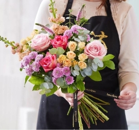 Hand tied bouquet made with the finest flowers.