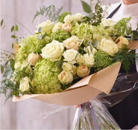 Sympathy hand tied made with the finest flower .